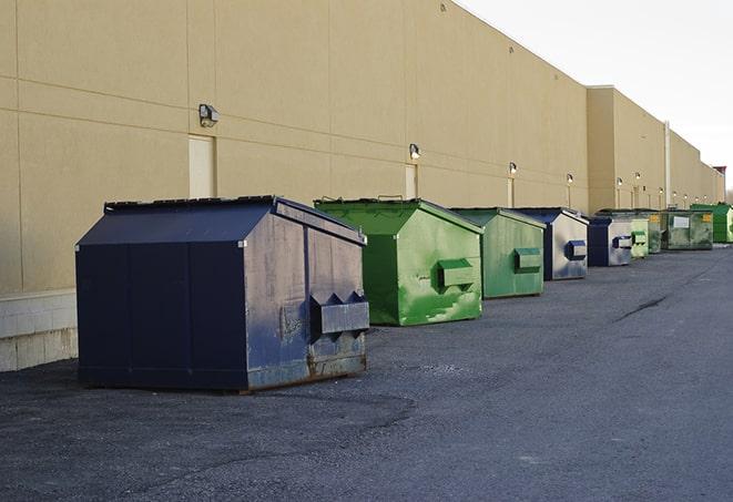 a row of heavy-duty dumpsters ready for use at a construction project in Albany, LA